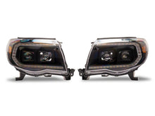 Load image into Gallery viewer, Raxiom 05-11 Toyota Tacoma Axial Series Switchback Projector Headlights- Black Housing- Clear Lens