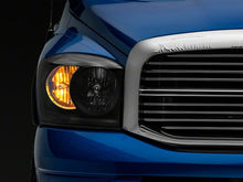 Load image into Gallery viewer, Raxiom 06-08 Dodge RAM 1500 Axial Series Euro Headlights- Black Housing- Clear Lens