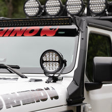 Load image into Gallery viewer, Go Rhino Xplor Blackout Series Round LED Driving Light w/DRL (Surface/Threaded Stud Mnt) 7in. - Blk