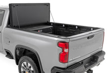 Load image into Gallery viewer, Hard Tri-Fold Flip Up Bed Cover | 6'9" Bed | Chevy/GMC  Silverado/Sierra 2500HD/3500HD (20-26)