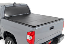 Load image into Gallery viewer, Hard Tri-Fold Flip Up Bed Cover | 5'7" Bed | Toyota Tundra 2WD/4WD (07-21)