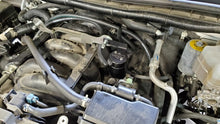 Load image into Gallery viewer, J&amp;L 17-24 Nissan Armada / 14-24 Infiniti QX80 5.6L Driver Side Oil Separator 3.0 - Black Anodize