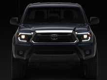 Load image into Gallery viewer, Raxiom 12-15 Toyota Tacoma Axial Series Switchback Projector Headlights- Black Housing- Clear Lens