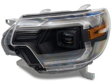 Load image into Gallery viewer, Raxiom 12-15 Toyota Tacoma Axial Series Switchback Projector Headlights- Black Housing- Clear Lens